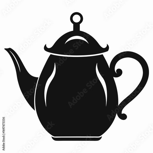 A black tea pot with a lid and handle. The handle is curved and the lid is shaped like a teapot