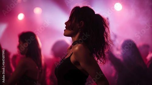 Friends dancing together under vibrant disco lights at a lively night party