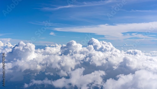 Wallpaper Mural High-altitude view of puffy white clouds against a vibrant blue sky Torontodigital.ca