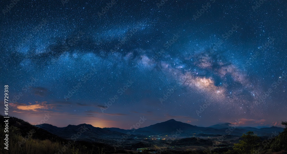 Fototapeta premium Panoramic view of the Milky Way over mountains