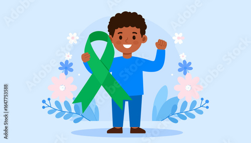 Smiling African American boy holds a large green ribbon symbolizing support for an awareness campaign.
