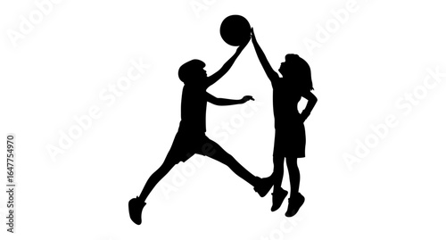 Silhouette of two children in mid-air, actively playing basketball.