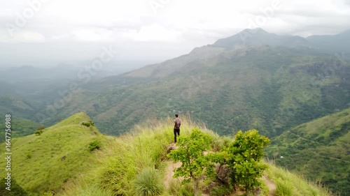 Traveler Admiring Mountain Landscape in Ella, Sri Lanka – Aerial Boomerang Shot