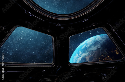 Fototapeta Naklejka Na Ścianę i Meble -  View from the cabin of a spaceship to the planet Earth and the sunrise. View from outer space. Elements of this image furnished by NASA.