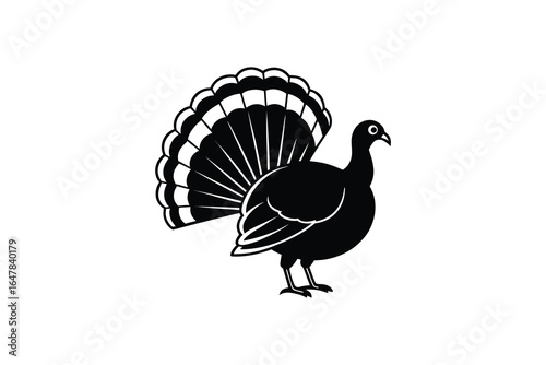 A black silhouette of a turkey with its feathers spread out