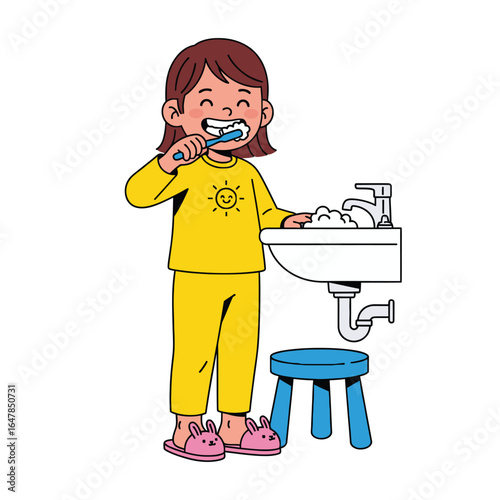 A cheerful young girl in yellow pajamas happily brushing her teeth at a bathroom sink.