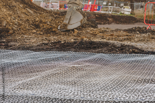 Canvas Print Groundwork preparation with geogrid wire mesh laid out on sub-soil surface for g