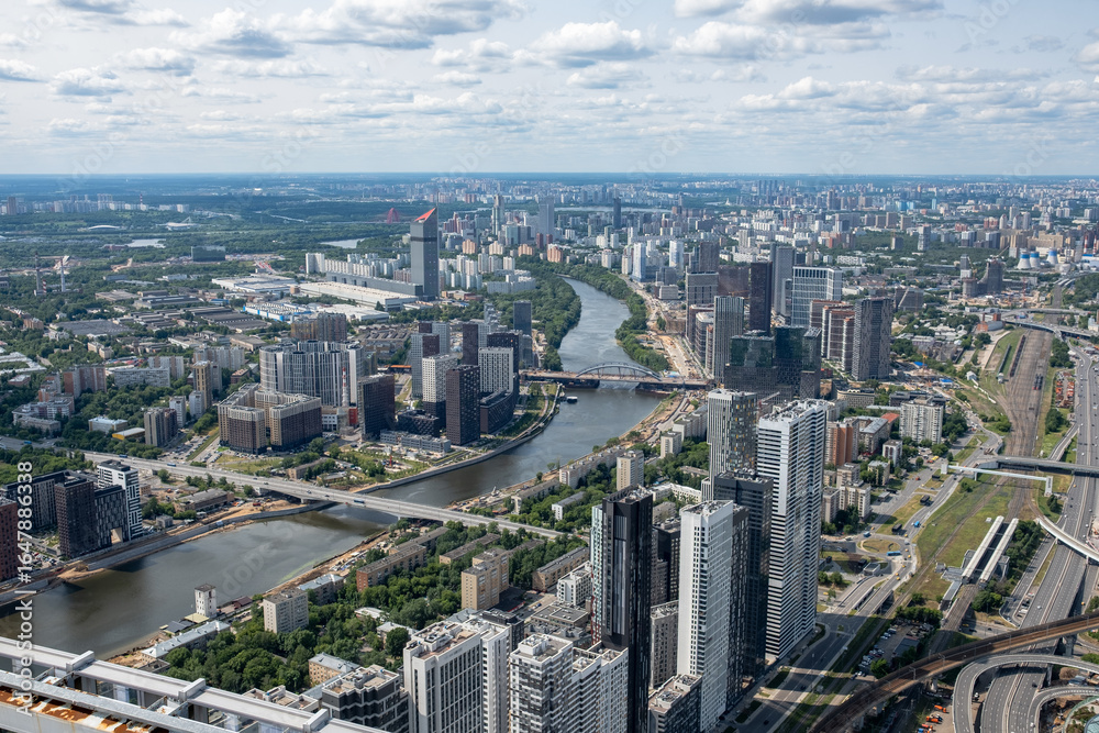 Fototapeta premium View of Moscows Skyline Showcasing Modern Architecture and River Landscape Under a Clear Sky During Daytime