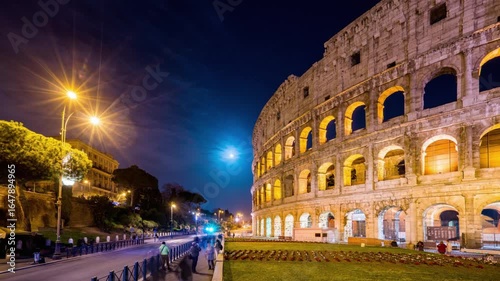 The colosseum illuminated at night with a full moon in rome, italy