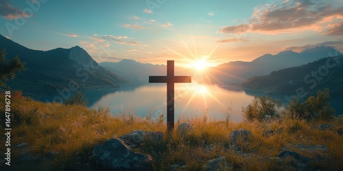 Scenic sunrise over a tranquil lake with a wooden cross on the shore surrounded by mountains and lush greenery