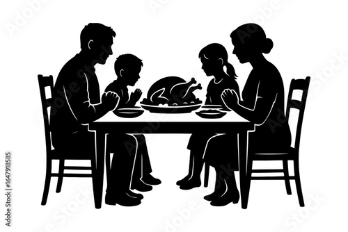 Family praying before holiday dinner with roasted turkey. Thanksgiving and family values concept.