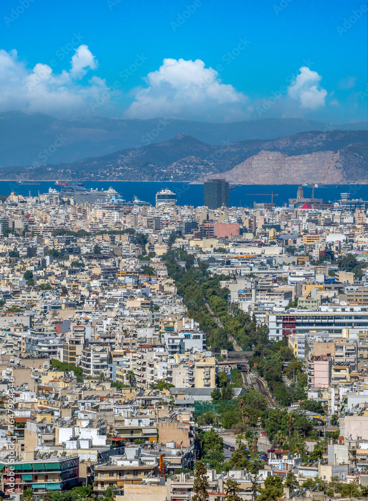 Obraz premium View of the port of Piraeus and the city of Athens from the top of the historical rocky hill Aeropagus, Athens, Attica, Greece