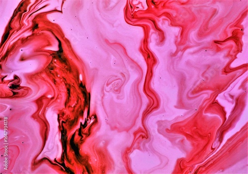 abstract background of red and pink paint in water, liquid marble