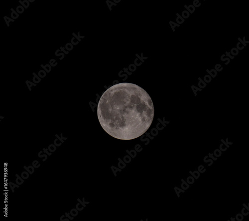 Full bright moon in clear dark sky