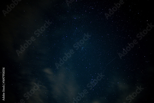space background with stars and light clouds
