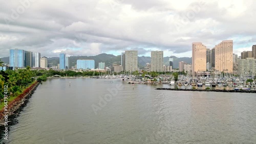 Stunning Aerial Drone Footage of the Ala Wai Boat Harbor with the Iconic Honolulu Cityscape in the Background.