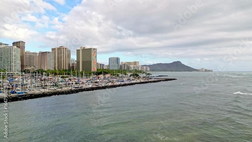 Aerial Drone Footage Showcasing Ala Wai Harbor with the Iconic Honolulu Cityscape and Majestic Diamond Head Crater in the Background