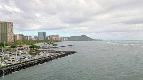 Aerial Drone Footage Showcasing Ala Wai Harbor with the Iconic Honolulu Cityscape and Majestic Diamond Head Crater in the Background