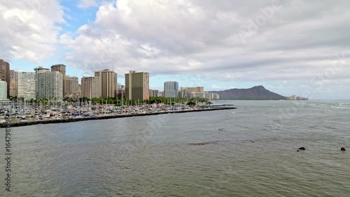 Aerial Drone Footage Showcasing Ala Wai Harbor with the Iconic Honolulu Cityscape and Majestic Diamond Head Crater in the Background