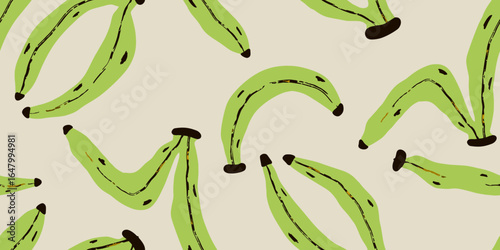 Green bananas scattered on beige surface pattern