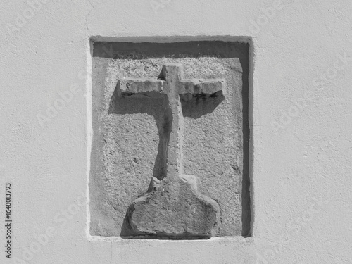 Latin cross embedded in the wall, the longitudinal beam symbolizes connection between God and man, while the crossbeam represents the connection between people