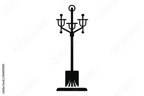 Ornate ThreeLamp Street Light Silhouette Featuring Unique Base And Spherical Finial Detail