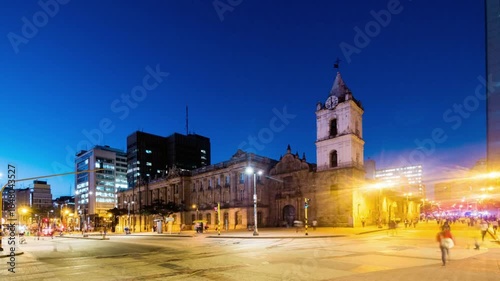 Illuminated salta cathedral and buildings on 9 de julio plaza at dusk, argentina
