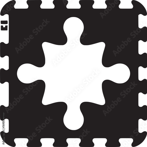 A black and white interlocking foam mat with a white puzzle piece shape in the center of the mat