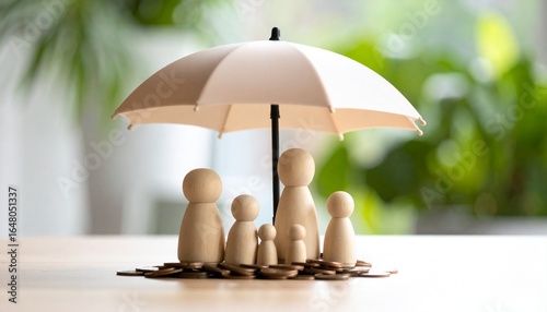Bright indoor scene with umbrella spread out over a pile of coins on a table with a wooden doll family standing next to it
