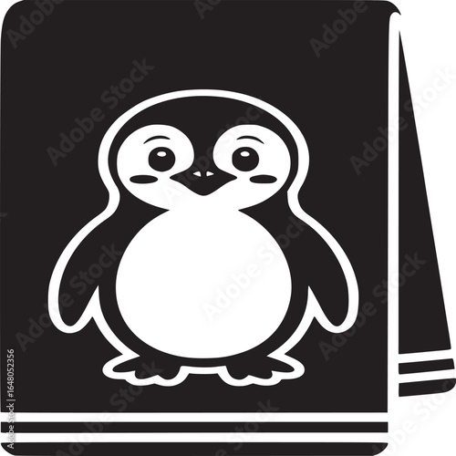 Black and white image of a towel with a cartoon penguin design on it in the center of the towel