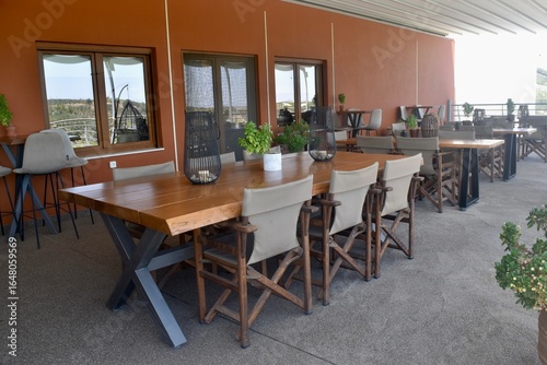 Outdoor balcony restaurant at a grape and olive orchard in Crete, Greece