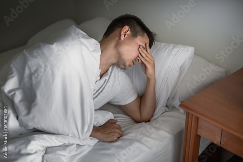Quadro su tela Man getting bad sleep waking up tired feeling burnt out exhausted