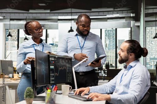 Teamworking colleagues oversee investment portfolios to maximize returns for clients. Team of portfolio managers doing brainstorming after reviewing assets performance to adjust holdings