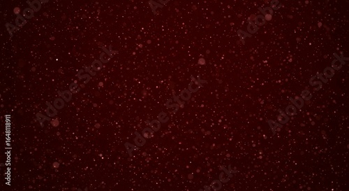 Dark burgundy red bokeh background with floating luminous particles and soft focus effect for luxury brand presentations
