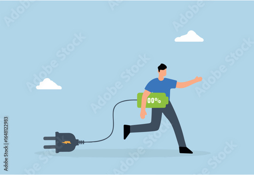 Full recharge energized, driven entrepreneur holds a fully charged battery prepared to strive for achievement.