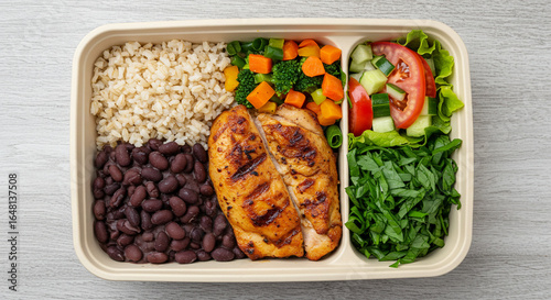 Traditional Brazilian Lunch Box with Grilled Chicken, Black Beans, Brown Rice, Roasted Vegetables, and Fresh Salad – Balanced Meal Photography