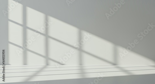 Natural window shadows creating grid pattern on white wall surface, minimalist architectural lighting for contemporary interior backgrounds