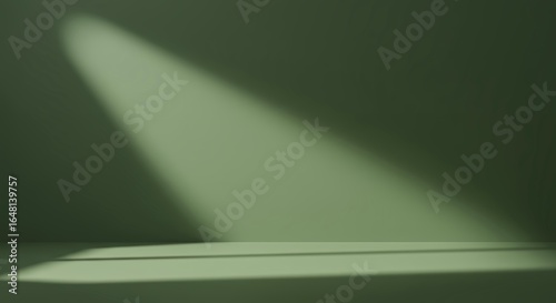 Deep sage green studio backdrop with soft spotlight beam and empty horizontal shelf for elegant natural product display and commercial mockup