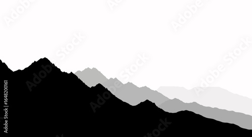 Silhouette of mountain ranges fading into the distance with a bright white background landscape view