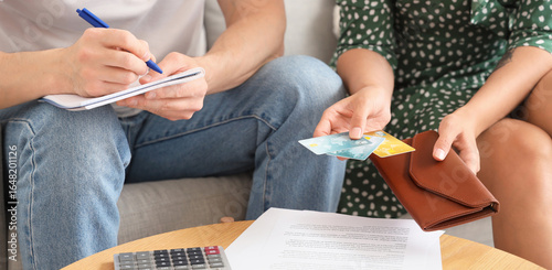 Young woman holding credit ...