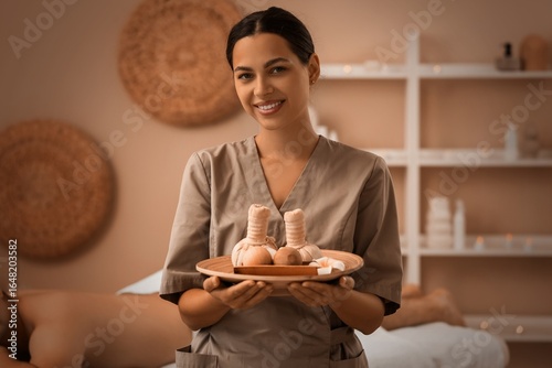 Female massage therapist wi...