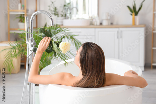Beautiful woman with rose t...