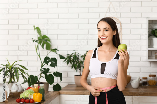 Sporty young woman with app...