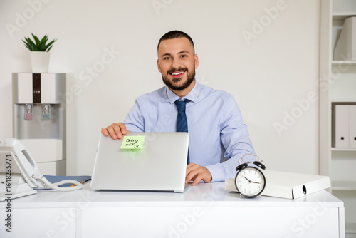 Young businessman with lapt...