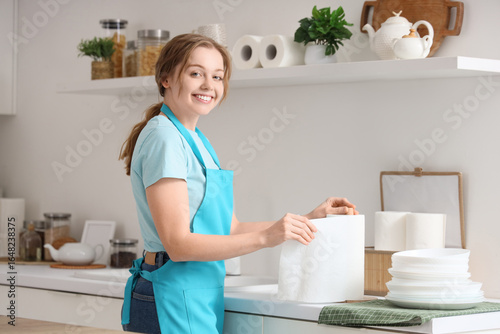 Young woman with roll of pa...