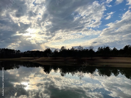 Dramatic Clouds Reflected on Calm Lake