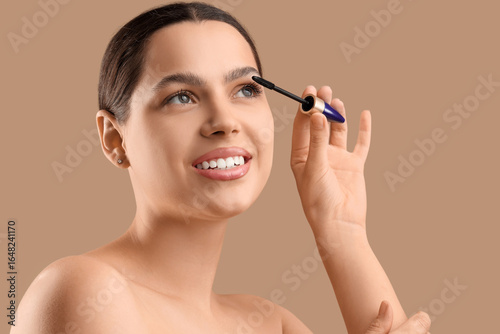 Pretty young woman applying...