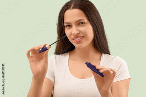 Pretty young woman with mas...