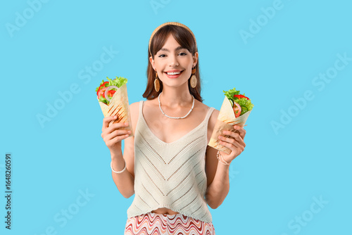 Young woman with tasty sand...