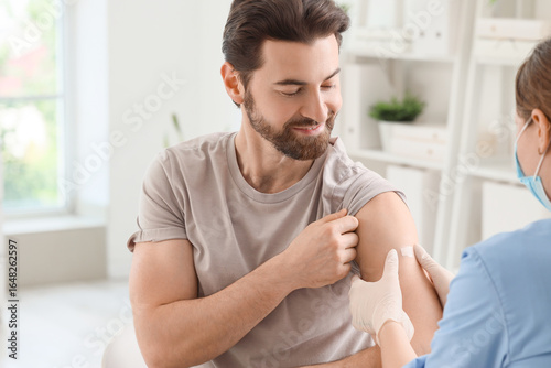 Young man with doctor apply...